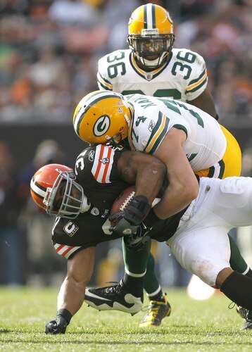 CLEVELAND, OH - OCTOBER 25: Jamal Lewis #31 of the Cleveland Browns is tackled by Aaron Kampman #74 and Nick Collins #36 of the Green Bay Packers at Cleveland Browns at Cleveland Browns Stadium on October 25, 2009 in Cleveland, Ohio.  <br /><br /><span class="help">(Photo by Matt Sullivan/Getty Images)</span>