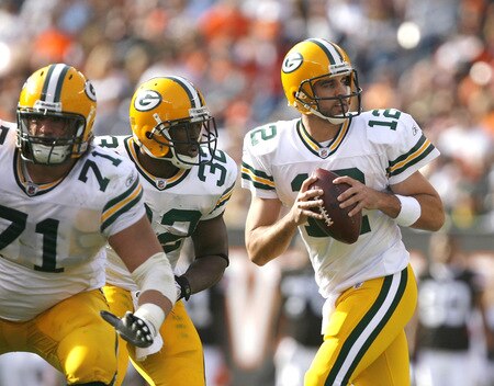 CLEVELAND, OH - OCTOBER 25:  Aaron Rodgers #12 of the Green Bay Packers drops back to pass as he gets protection from Brandon Jackson #32 and Josh Sitton #71 against the Cleveland Browns at Cleveland Browns Stadium on October 25, 2009 in Cleveland, Ohio.  <br /><br /><span class="help">(Photo by Matt Sullivan/Getty Images)</span>