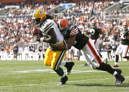 CLEVELAND, OH - OCTOBER 25:  Quinn Johnson #45 of the Green Bay Packers makes a catch as he is hit by David Bowens #96of the Cleveland Browns at Cleveland Browns Stadium on October 25, 2009 in Cleveland, Ohio.  <br /><br /><span class="help">(Photo by Matt Sullivan/Getty Images)</span>