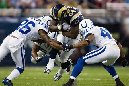 ST. LOUIS, MO - OCTOBER 25: Randy McMichael #84 of the St. Louis Rams is tackled by Kelvin Hayden #26 and Antoine Bethea #41 of the Indianapolis Colts at the Edward Jones Dome on October 25, 2009 in St. Louis, Missouri.  <br /><br /><span class="help">(Photo by Dilip Vishwanat/Getty Images)</span>