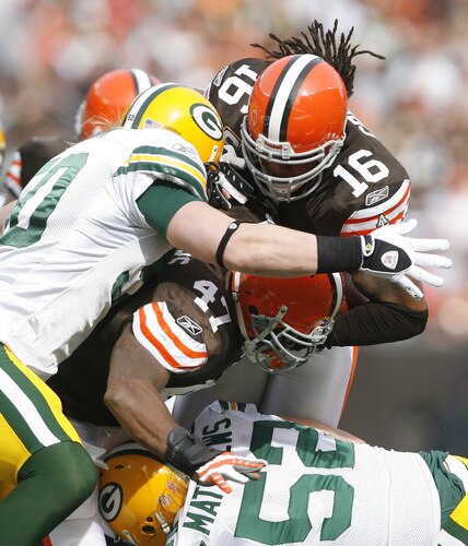 CLEVELAND, OH - OCTOBER 25:  Joshua Cribbs #16 of the Cleveland Browns is hit by A.J. Hawk #50 and Clay Matthews #52 of the Green Bay Packers at Cleveland Browns at Cleveland Browns Stadium on October 25, 2009 in Cleveland, Ohio.  <br /><br /><span class="help">(Photo by Matt Sullivan/Getty Images)</span>