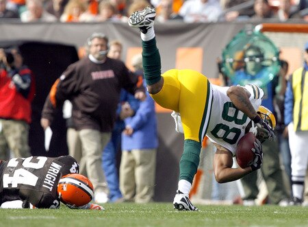 CLEVELAND, OH - OCTOBER 25:  Jermichael Finley #88 of the Green Bay Packers is hit by Eric Wright #24 of the Cleveland Browns at Cleveland Browns Stadium on October 25, 2009 in Cleveland, Ohio.  <br /><br /><span class="help">(Photo by Matt Sullivan/Getty Images)</span>