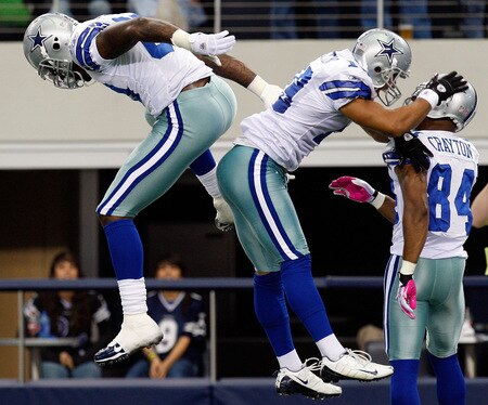 ARLINGTON, TX - OCTOBER 25:  Miles Austin (C) #19 of the Dallas Cowboys celebrates a touchdown with Martellus Bennett #80 and Patrick Crayton #84 against the Atlanta Falcons at Cowboys Stadium on October 25, 2009 in Arlington, Texas.  <br /><br /><span class="help">(Photo by Ronald Martinez/Getty Images)</span>