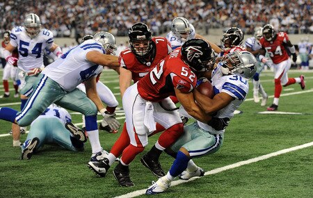 ARLINGTON, TX - OCTOBER 25:  Kickoff return specialist Allen Rossum #30 of the Dallas Cowboys is tackled by Coy Wire #52 of the Atlanta Falcons at Cowboys Stadium on October 25, 2009 in Arlington, Texas.  <br /><br /><span class="help">(Photo by Ronald Martinez/Getty Images)</span>
