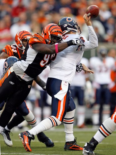 CINCINNATI - OCTOBER 25:  Jay Cutler #6 of the Chicago Bears throws the ball as he is hit by Frostee Rucker #92 of the Cincinnati Bengals at Paul Brown Stadium on October 25, 2009 in Cincinnati, Ohio. The Bengals won 45-10.  <br /><br /><span class="help">(Photo by Andy Lyons/Getty Images)</span>