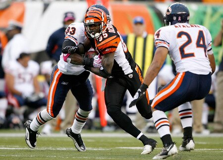 CINCINNATI - OCTOBER 25:  Chad Ochocinco #85 of the Cincinnati Bengals runs with the ball while defended by Charles Tillman #33 of the Chicago Bears during the NFL game at Paul Brown Stadium on October 25, 2009 in Cincinnati, Ohio.  The Bengals won 45-10.  <br /><br /><span class="help">(Photo by Andy Lyons/Getty Images)</span>