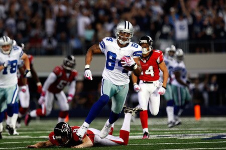 ARLINGTON, TX - OCTOBER 25:   Patrick Crayton #84 of the Dallas Cowboys runs for a touchdown past Michael Koenen #9 of the Atlanta Falcons at Cowboys Stadium on October 25, 2009 in Arlington, Texas.  <br /><br /><span class="help">(Photo by Ronald Martinez/Getty Images)</span>