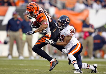 CINCINNATI - OCTOBER 25:  Andre Caldwell #87 of the Cincinnati Bengals runs with the ball whihle defended by Danieal Manning #38 of the Chicago Bears during the NFL game at Paul Brown Stadium on October 25, 2009 in Cincinnati, Ohio.  The Bengals won 45-10.  <br /><br /><span class="help">(Photo by Andy Lyons/Getty Images)</span>