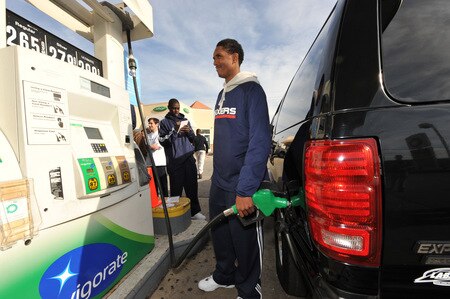 PHILADELPHIA - OCTOBER 26: Louis Williams of the Philadelphia 76ers fills up a gas tank during a Paint the Town event on October 26, 2009 at the BP gas station in Philadelphia, Pennsylvania.  <br /><br /><span class="help">(Photo by Jesse D. Garrabrant/NBAE via Getty Images)</span>