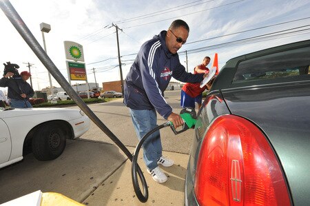 PHILADELPHIA - OCTOBER 26: Randy Ayers, assistant coach of the Philadelphia 76ers, fills up a gas tank  during a Paint the Town event on October 26, 2009 at the BP gas station in Philadelphia, Pennsylvania.  <br /><br /><span class="help">(Photo by Jesse D. Garrabrant/NBAE via Getty Images)</span>