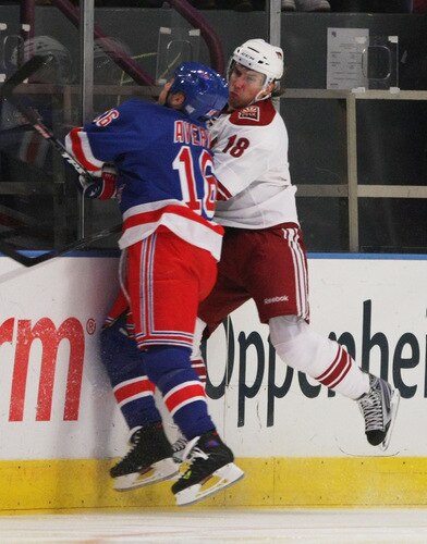 NEW YORK - OCTOBER 26:  Sean Avery #16 of the New York Rangers hits Sami Lepisto #18 of the Phoenix Coyotes on October 26, 2009 at Madison Square Garden in New York, New York. <br /><br /><span class="help">(Photo by Bruce Bennett/Getty Images)</span>