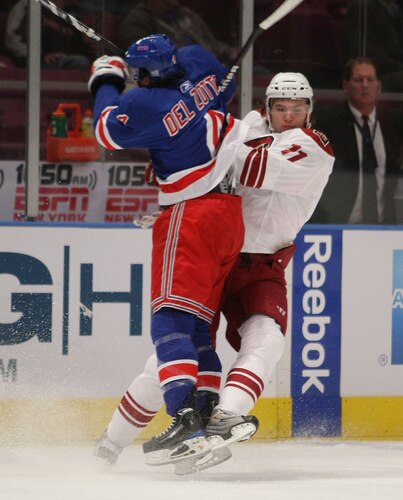 NEW YORK - OCTOBER 26:  Michael Del Zotto #4 of the New York Rangers hits Martin Hanzal #11 of the Phoenix Coyotes on October 26, 2009 at Madison Square Garden in New York, New York. <br /><br /><span class="help">(Photo by Bruce Bennett/Getty Images)</span>
