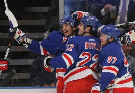NEW YORK - OCTOBER 26: (L-R) Artem Anisimov, Brian Boyle #22 and Matt Gilroy #97 of the New York Rangers celebrate Anisimov's first period goal against of the Phoenix Coyotes on October 26, 2009 in New York City. <br /><br /><span class="help">(Photo by Bruce Bennett/Getty Images)</span>