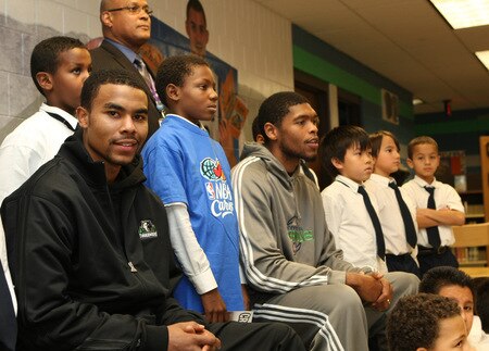 ST. PAUL, MN - OCTOBER 26:  Ramon Sessions and Ryan Gomes pose for pictures with students at the Fastbreak Foundation Basketball Reading and Learning Center dedication at the University Academy for Boys and Girls at North End Elementary School on October 26, 2009 in St. Paul, Minnesota.  <br /><br /><span class="help">(Photo by David Sherman/NBAE via Getty Images)</span>
