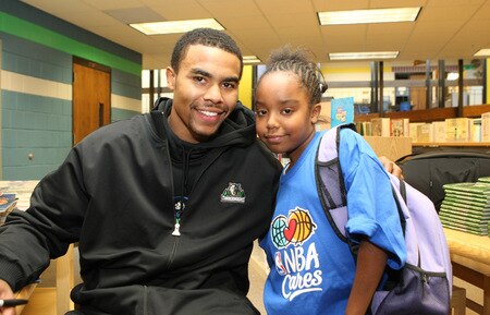 ST. PAUL, MN - OCTOBER 26:  Ramon Sessions poses with a student  at the Fastbreak Foundation Basketball Reading and Learning Center dedication at the University Academy for Boys and Girls at North End Elementary School on October 26, 2009 in St. Paul, Minnesota.  <br /><br /><span class="help">(Photo by David Sherman/NBAE via Getty Images)</span>