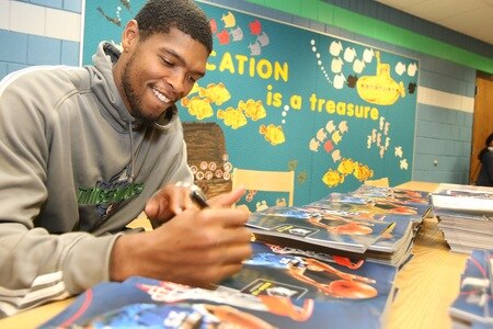 ST. PAUL, MN - OCTOBER 26:  Ryan Gomes poses for pictures and sign autographs after the Fastbreak Foundation Basketball Reading and Learning Center dedication at the University Academy for Boys and Girls at North End Elementary School on October 26, 2009 in St. Paul, Minnesota.  <br /><br /><span class="help">(Photo by David Sherman/NBAE via Getty Images)</span>
