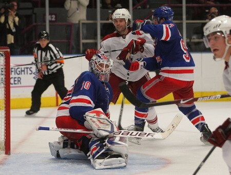 NEW YORK - OCTOBER 26: Henrik Lundqvist #30 of the New York Rangers kicks aside a shot as Robert Lang #20 of the Phoenix Coyotes looks for a rebound at Madison Square Garden on October 26, 2009 in New York, New York. The Rangers defeated the Coyotes 5-2. <br /><br /><span class="help">(Photo by Bruce Bennett/Getty Images)</span>