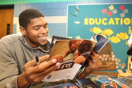 ST. PAUL, MN - OCTOBER 26:  Ryan Gomes poses for pictures and signs autographs after the Fastbreak Foundation Basketball Reading and Learning Center dedication at the University Academy for Boys and Girls at North End Elementary School on October 26, 2009 in St. Paul, Minnesota.  <br /><br /><span class="help">(Photo by David Sherman/NBAE via Getty Images)</span>