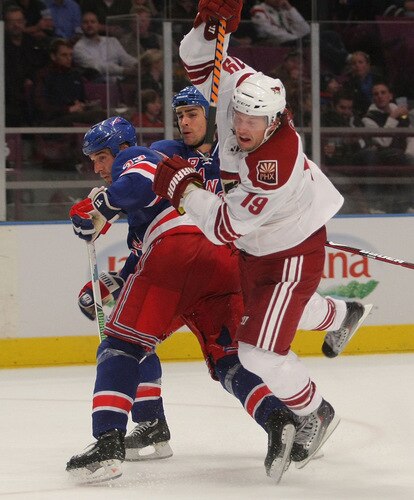 NEW YORK - OCTOBER 26: Shane Doan #19 of the Phoenix Coyotes is tripped up by Michal Rozsival #33 of the New York Rangers at Madison Square Garden on October 26, 2009 in New York City. The Rangers defeated the Coyotes 5-2. <br /><br /><span class="help">(Photo by Bruce Bennett/Getty Images)</span>
