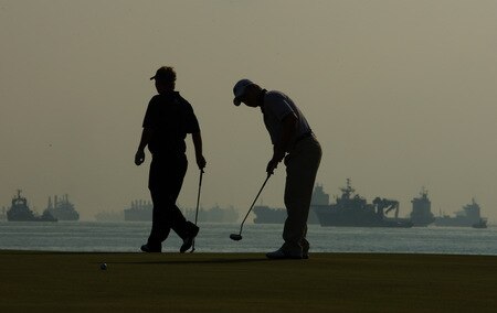 SINGAPORE - OCTOBER 27:  Ross McGowan of England looks on at Richard Sterne of South Africa on the 5th green during the practice round of the Barclays Singapore Open at Sentosa Golf Club on October 27, 2009 in Singapore.  <br /><br /><span class="help">(Photo by Ian Walton/Getty Images)</span>
