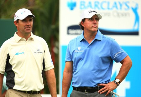 SINGAPORE - OCTOBER 27:  Padraig Harrington of Ireland and Phil Mickelson of USA look down the 14th during the practice round of the Barclays Singapore Open at Sentosa Golf Club on October 27, 2009 in Singapore, Singapore.  <br /><br /><span class="help">(Photo by Ian Walton/Getty Images)</span>