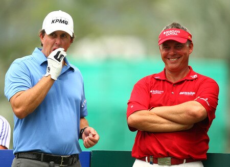 SINGAPORE - OCTOBER 27:  Darren Clark (R) of Northern Ireland and Phil Mickelson of USA look down the 11th during the practice round of the Barclays Singapore Open at Sentosa Golf Club on October 27, 2009 in Singapore.  <br /><br /><span class="help">(Photo by Ian Walton/Getty Images)</span>