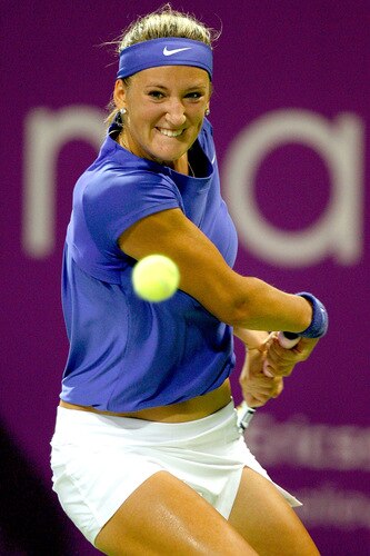 DOHA, QATAR - OCTOBER 27:  Victoria Azaraenka of Belarus returns a shot to Jelena Jankovic of Serbia in game one of round robin play during the Sony Ericsson WTA Championships at the Khalifa International Tennis and Squash Complex on October 27, 2009 in Doha, Qatar.  <br /><br /><span class="help">(Photo by Matthew Stockman/Getty Images)</span>