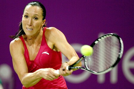 DOHA, QATAR - OCTOBER 27: Jelena Jankovic of Serbia returna shot to Victoria Azraenka of Belarus in game one of round robin play during the Sony Ericsson WTA Championships at the Khalifa International Tennis and Squash Complex on October 27, 2009 in Doha, Qatar.  <br /><br /><span class="help">(Photo by Matthew Stockman/Getty Images)</span>