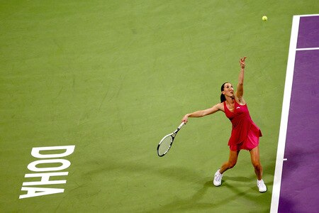 DOHA, QATAR - OCTOBER 27:  Jelena Jankovic of Serbia serves to Victoria Azraenka of Belarus in game one of round robin play during the Sony Ericsson WTA Championships at the Khalifa International Tennis and Squash Complex on October 27, 2009 in Doha, Qatar.  <br /><br /><span class="help">(Photo by Matthew Stockman/Getty Images)</span>
