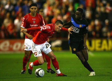 BARNSLEY, ENGLAND - OCTOBER 27:  Adam Hammill (L) of Barnsley holds off a challenge from Danny Welbeck of Manchester United during the Carling Cup 4th Round match between Barnsley and Manchester United at Oakwell on October 27, 2009 in Barnsley, England.  <br /><br /><span class="help">(Photo by Alex Livesey/Getty Images)</span>