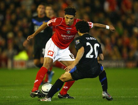 BARNSLEY, ENGLAND - OCTOBER 27:  Anderson of Barnsley turns away from Fabio Da Silva of Manchester United during the Carling Cup 4th Round match between Barnsley and Manchester United at Oakwell on October 27, 2009 in Barnsley, England.  <br /><br /><span class="help">(Photo by Alex Livesey/Getty Images)</span>