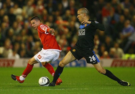 BARNSLEY, ENGLAND - OCTOBER 27:  Gabriel Obertan of Manchester United beats Adam Hammill of Barnsley during the Carling Cup 4th Round match between Barnsley and Manchester United at Oakwell on October 27, 2009 in Barnsley, England.  <br /><br /><span class="help">(Photo by Alex Livesey/Getty Images)</span>