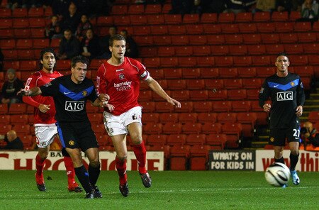 BARNSLEY, ENGLAND - OCTOBER 27:  Michael Owen (L) of Manchester United scores the second goal during the Carling Cup 4th Round match between Barnsley and Manchester United at Oakwell on October 27, 2009 in Barnsley, England.  <br /><br /><span class="help">(Photo by Alex Livesey/Getty Images)</span>