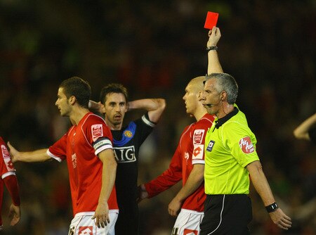 BARNSLEY, ENGLAND - OCTOBER 27:  Referee Chris Foy shows the red card to Gary Neville of Manchester United during the Carling Cup 4th Round match between Barnsley and Manchester United at Oakwell on October 27, 2009 in Barnsley, England.  <br /><br /><span class="help">(Photo by Alex Livesey/Getty Images)</span>