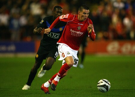 BARNSLEY, ENGLAND - OCTOBER 27:  Adam Hammill of Barnsley beats Danny Welbeck of Manchester United during the Carling Cup 4th Round match between Barnsley and Manchester United at Oakwell on October 27, 2009 in Barnsley, England.  <br /><br /><span class="help">(Photo by Alex Livesey/Getty Images)</span>