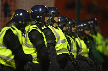BARNSLEY, ENGLAND - OCTOBER 27:  Riot police line up in front of the Manchester United supporters during the Carling Cup 4th Round match between Barnsley and Manchester United at Oakwell on October 27, 2009 in Barnsley, England.  <br /><br /><span class="help">(Photo by Alex Livesey/Getty Images)</span>