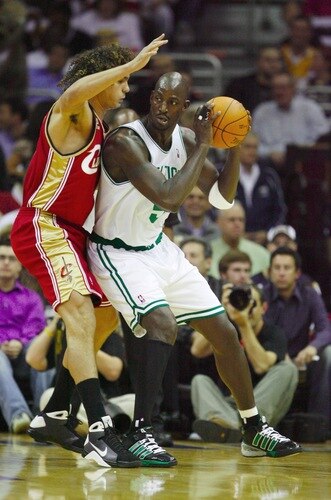 CLEVELAND - OCTOBER 27:  Kevin Garnett #5 of the Boston Celtics drives the ball against Anderson Varejao #17 of the Cleveland Cavaliers during the season opener at Quicken Loans Arena on October 27, 2009 in Cleveland, Ohio.  <br /><br /><span class="help">(Photo by Gregory Shamus/Getty Images)</span>