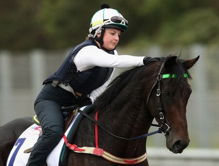MELBOURNE, AUSTRALIA - OCTOBER 28:  Lizzie Jelfs pats Changing of the Guard on the head during trackwork at Sandown Racecourse on October 28, 2009 in Melbourne, Australia.  <br /><br /><span class="help">(Photo by Quinn Rooney/Getty Images)</span>