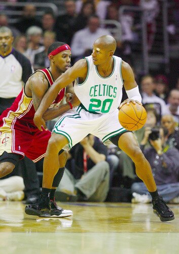 CLEVELAND - OCTOBER 27:  Ray Allen #20 of the Boston Celtics drives the ball against Daniel Gibson #1 of the Cleveland Cavaliers during the season opener at Quicken Loans Arena on October 27, 2009 in Cleveland, Ohio.  <br /><br /><span class="help">(Photo by Gregory Shamus/Getty Images)</span>
