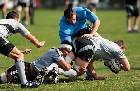 TOKYO - OCTOBER 28:  Tanerau Latimer (C) tackles Kieran Read during a New Zealand All Blacks training session at Kubota Spears Rugby Field in Chiba on October 28, 2009 in Funabashi, Japan.  <br /><br /><span class="help">(Photo by Ross Land/Getty Images)</span>