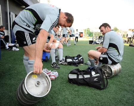 TOKYO - OCTOBER 28:  Tony Woodcock (L) and Andrew Hore strap on their boots during a New Zealand All Blacks training session at Kubota Spears Rugby Field in Chiba on October 28, 2009 in Funabashi, Japan.  <br /><br /><span class="help">(Photo by Ross Land/Getty Images)</span>