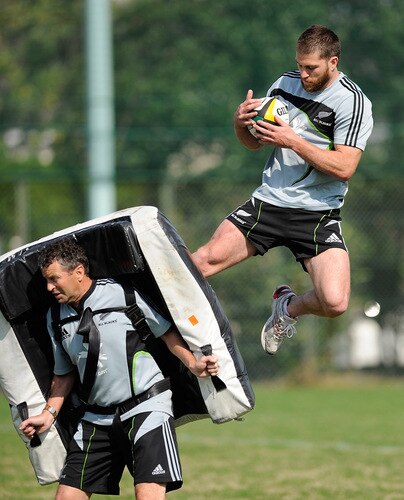 TOKYO - OCTOBER 28:  Cory Jane hits a padded bag held by assistant coach Wayne Smith (L) during a New Zealand All Blacks training session at Kubota Spears Rugby Field in Chiba on October 28, 2009 in Funabashi, Japan.  <br /><br /><span class="help">(Photo by Ross Land/Getty Images)</span>