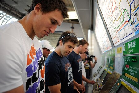TOKYO - OCTOBER 28:  (L to R) Anthony Boric, Conrad Smith and Wyatt Crocket buy tickets to catch the tube on a scenic tour around Tokyo following a New Zealand All Blacks training session at Kubota Spears Rugby Field in Chiba on October 28, 2009 in Funabashi, Japan.  <br /><br /><span class="help">(Photo by Ross Land/Getty Images)</span>