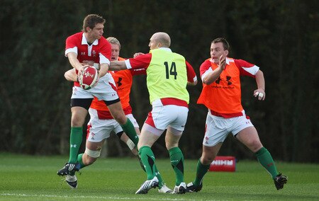 CARDIFF, WALES - OCTOBER 28: Dan Biggar is tackled by Tom Shanklin during Wales training at the Vale Resort on October 28 ,2009 in Cardiff, Wales.  <br /><br /><span class="help">(Photo by Stu Forster/Getty Images)</span>