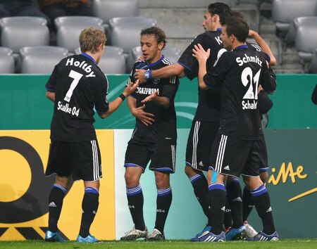 MUNICH, GERMANY - OCTOBER 28:  Rafinha (2nd L) of Schalke celebrates after scoring his team's first goal with his team mates (L-R) Lewis Holtby, Kevin Kuranyi and Lukas Schmitz during the DFB Cup round of 16 match between 1860 Muenchen and FC Schalke 04 at Allianz Arena on October 28, 2009 in Munich, Germany.  <br /><br /><span class="help">(Photo by Alexander Hassenstein/Bongarts/Getty Images)</span>