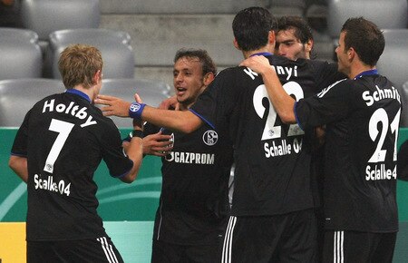 MUNICH, GERMANY - OCTOBER 28:  Rafinha (2nd L) of Schalke celebrates after scoring his team's first goal with team mates during the DFB Cup round of 16 match between 1860 Muenchen and FC Schalke 04 at Allianz Arena on October 28, 2009 in Munich, Germany.  <br /><br /><span class="help">(Photo by Alexander Hassenstein/Bongarts/Getty Images)</span>
