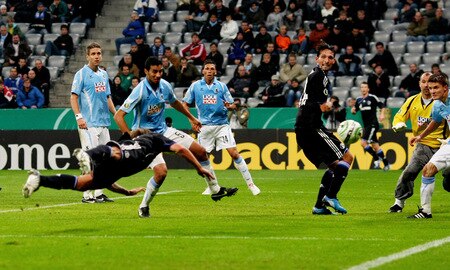 MUNICH, GERMANY - OCTOBER 28:  Benedikt Hoewedes (2nd L) of Schalke scores his team's third goal during the DFB Cup round of 16 match between 1860 Muenchen and FC Schalke 04 at Allianz Arena on October 28, 2009 in Munich, Germany.  <br /><br /><span class="help">(Photo by Alexander Hassenstein/Bongarts/Getty Images)</span>