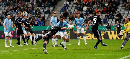 MUNICH, GERMANY - OCTOBER 28:   Benedikt Hoewedes (C) of Schalke scores his team's third goal during the DFB Cup round of 16 match between 1860 Muenchen and FC Schalke 04 at Allianz Arena on October 28, 2009 in Munich, Germany.  <br /><br /><span class="help">(Photo by Alexander Hassenstein/Bongarts/Getty Images)</span>