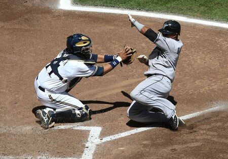 MILWAUKEE - MAY 14:  Catcher Mike Rivera #11 of the Milwaukee Brewers moves to tag out Emilio Bonifacio #1 of the Florida Marlins in the 5th inning on May 14, 2009 at Miller Park in Milwaukee, Wisconsin. <br /><br /><span class="help">(Photo by Jonathan Daniel/Getty Images)</span>