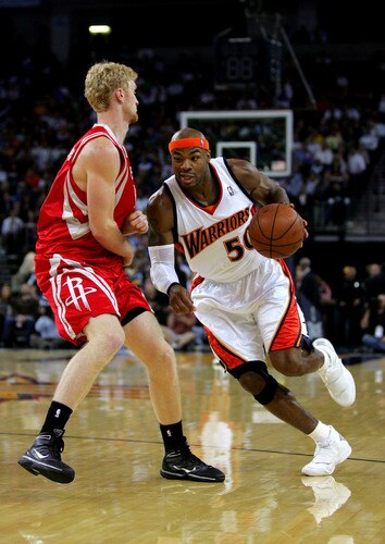 OAKLAND, CA - OCTOBER 28:  Corey Maggette #50 of the Golden State Warriors drives past Chase Budinger #10 of the Houston Rockets at Oracle Arena on October 28, 2009 in Oakland, California.  <br /><br /><span class="help">(Photo by Ezra Shaw/Getty Images)</span>
